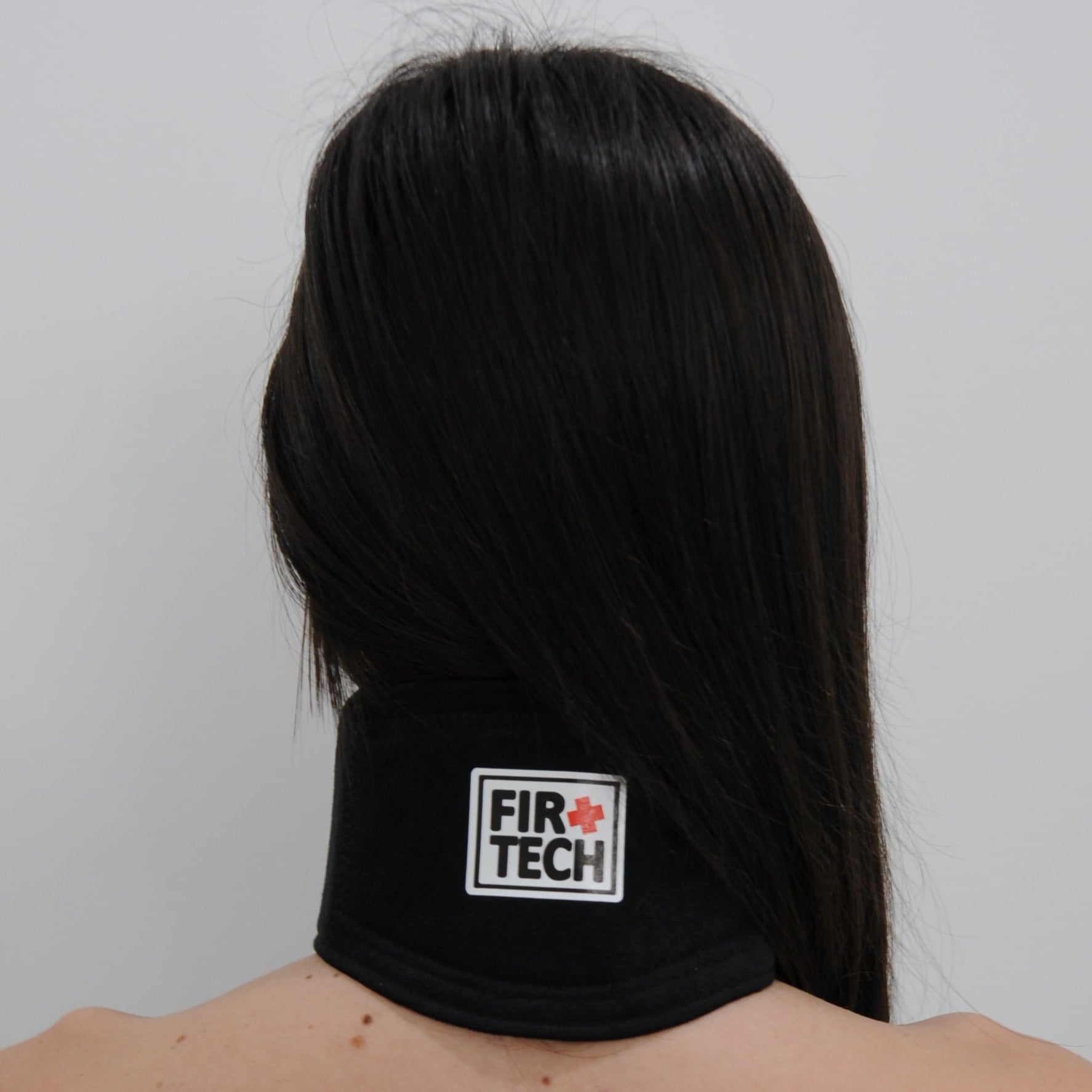 Person wearing a black headband with 'Fire Tech' logo on a white background